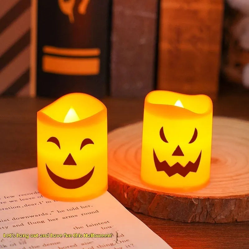 Set of six plastic pumpkin-coloured Halloween electric candle lamps in European style on a dark background