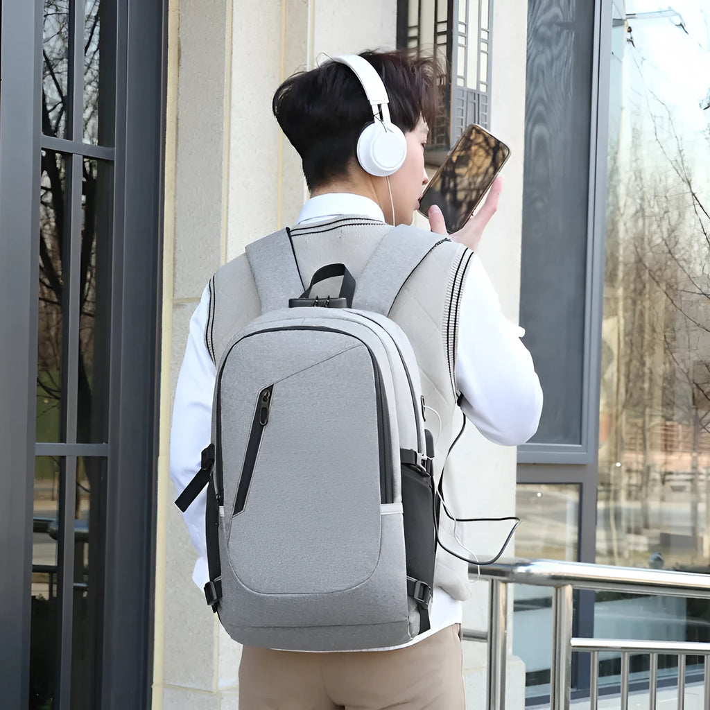 Blue unisex Oxford cloth computer backpack with a street style design, shown from the side.