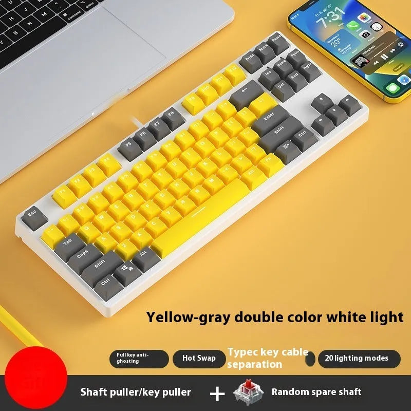 87-key wired mechanical keyboard with two-tone keycaps, shown with switch puller and cleaning brush