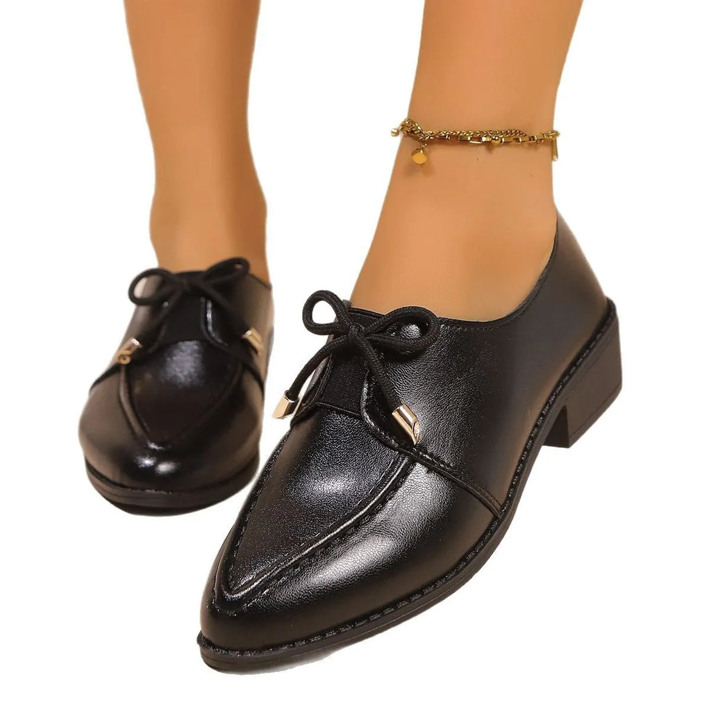 Women's simple leather shoes with a pointed toe and a choice of big bow or small bowknot detail.