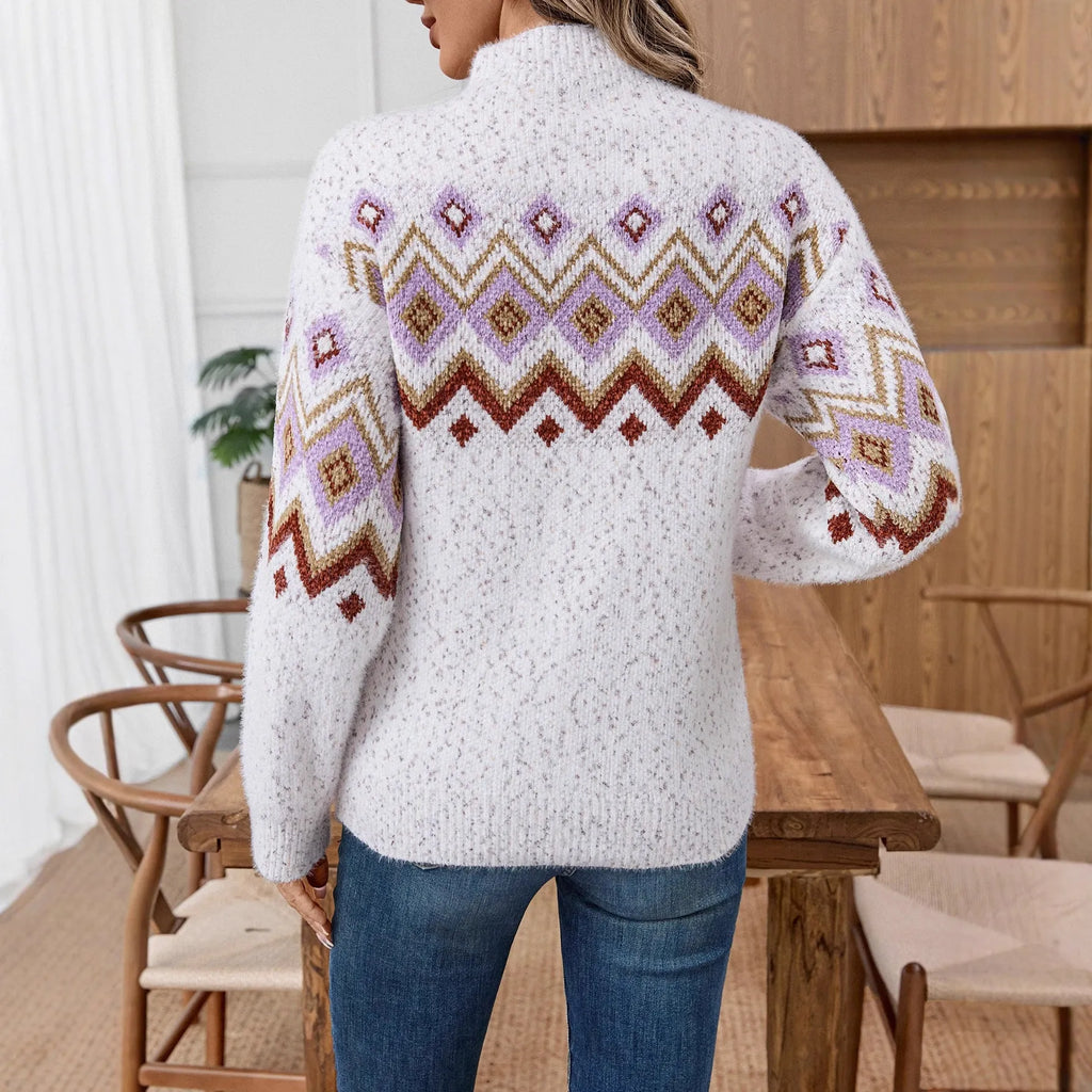 White half turtleneck loose sweater with a geometric jacquard pattern and long sleeves.