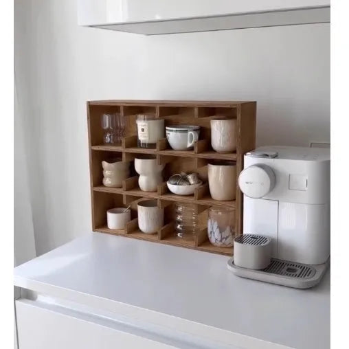 Solid birch wood cup storage rack with square compartments organising mugs on kitchen counter