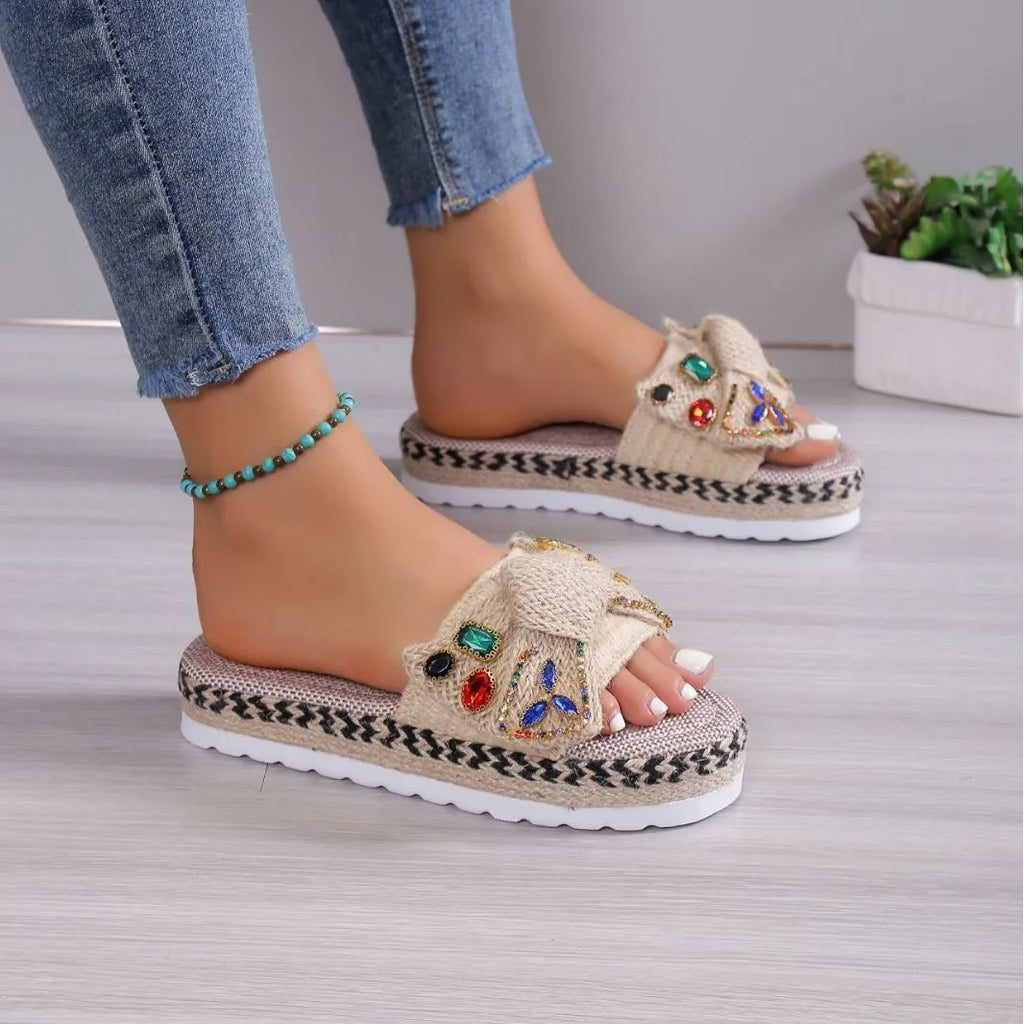 Creamy-white women's platform sandals with a cloth upper, round toe, and a decorative beach bow.