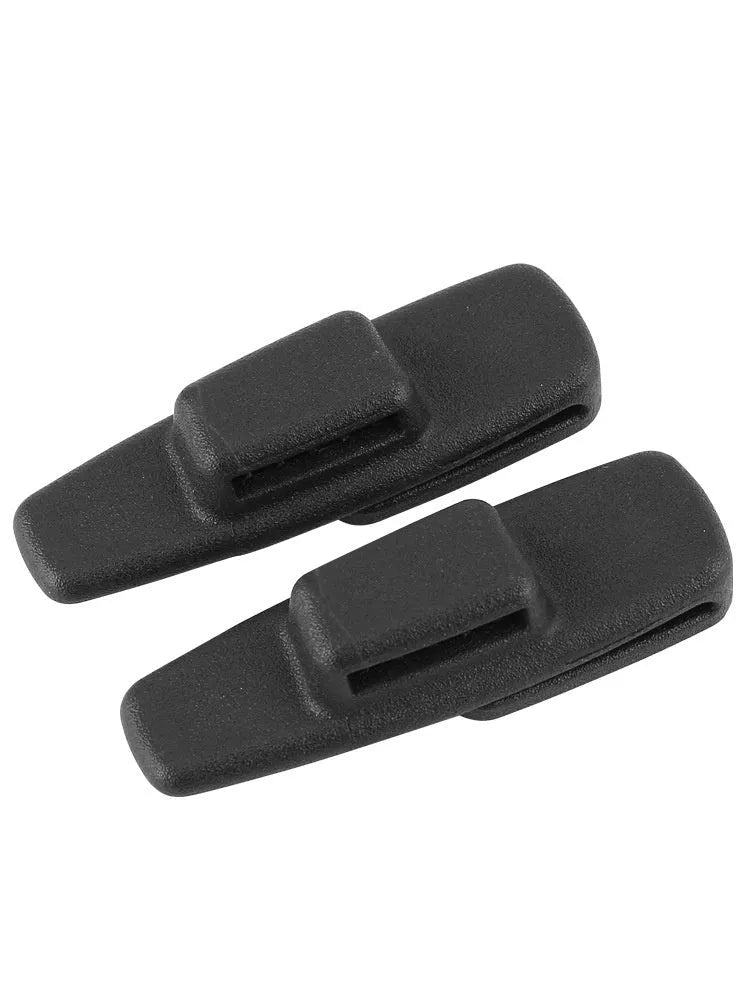 Two black ABS plastic car seatbelt adjustment clips packaged in a clear OPP bag.
