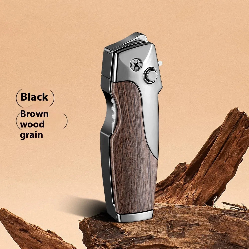 Closed metal folding lighter with integrated knife in a carbon fibre finish, showing the safety lock and refill valve.