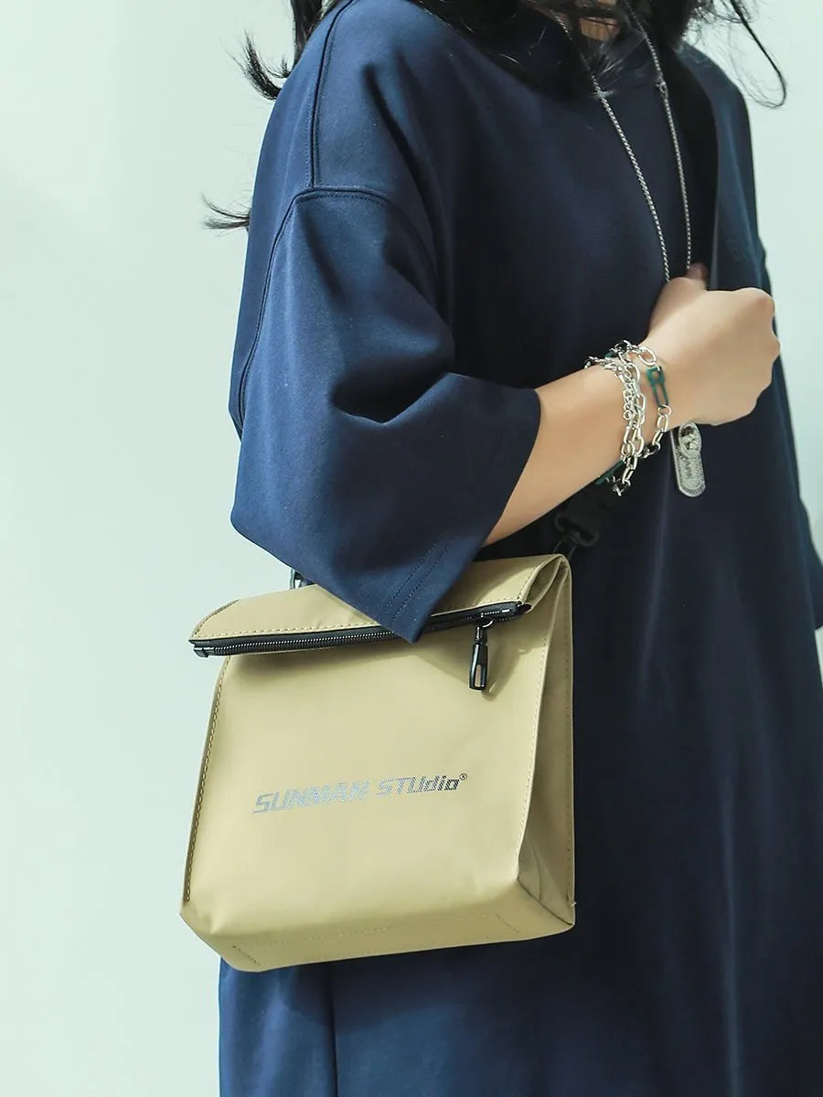 Messenger design backpack in polyester with crossbody strap and sewing line detailing