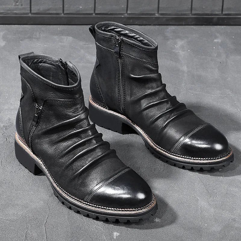 Black mid-calf cowboy boots with a side zipper, round toe, and a horseshoe heel on a plain background.