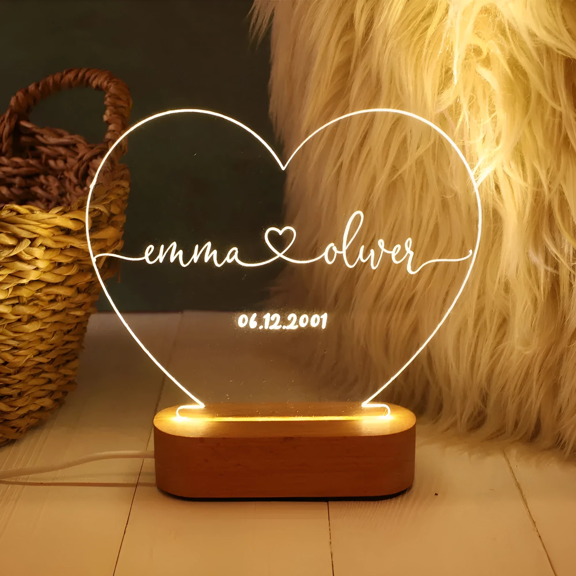 Custom acrylic LED night light with engraved names and date for Valentine's Day.