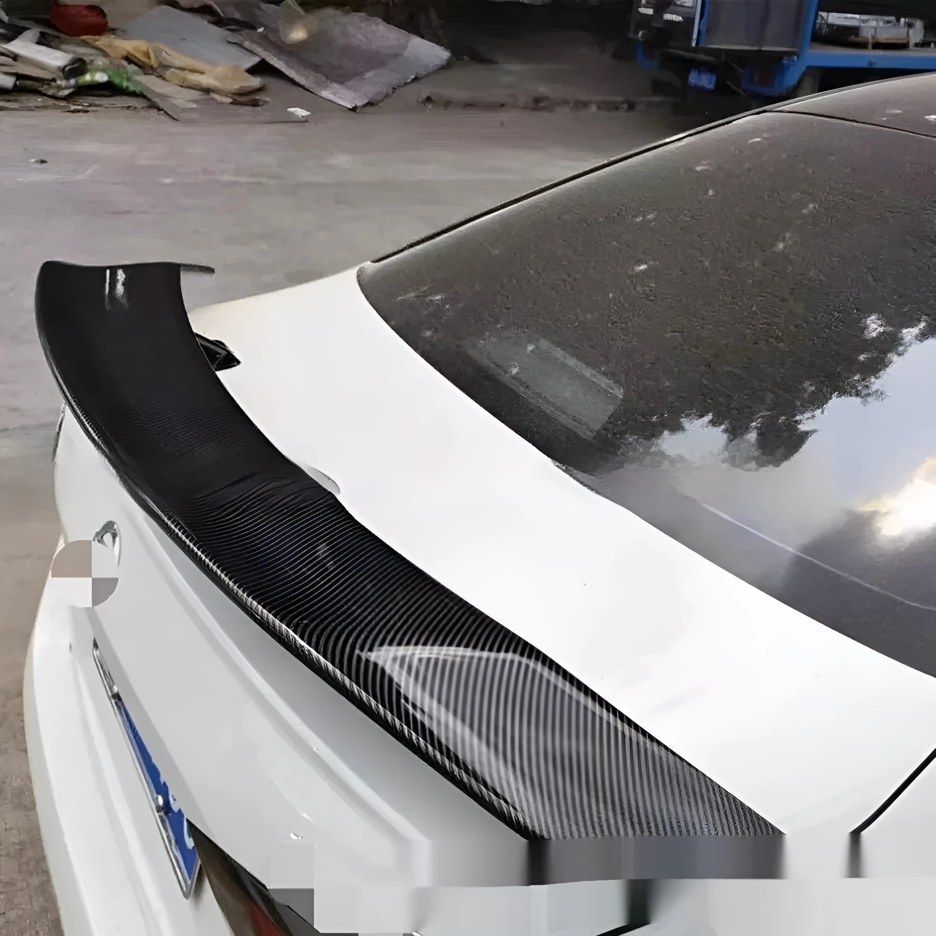 Universal punch-free car spoiler in ABS plastic shown in bright black finish.