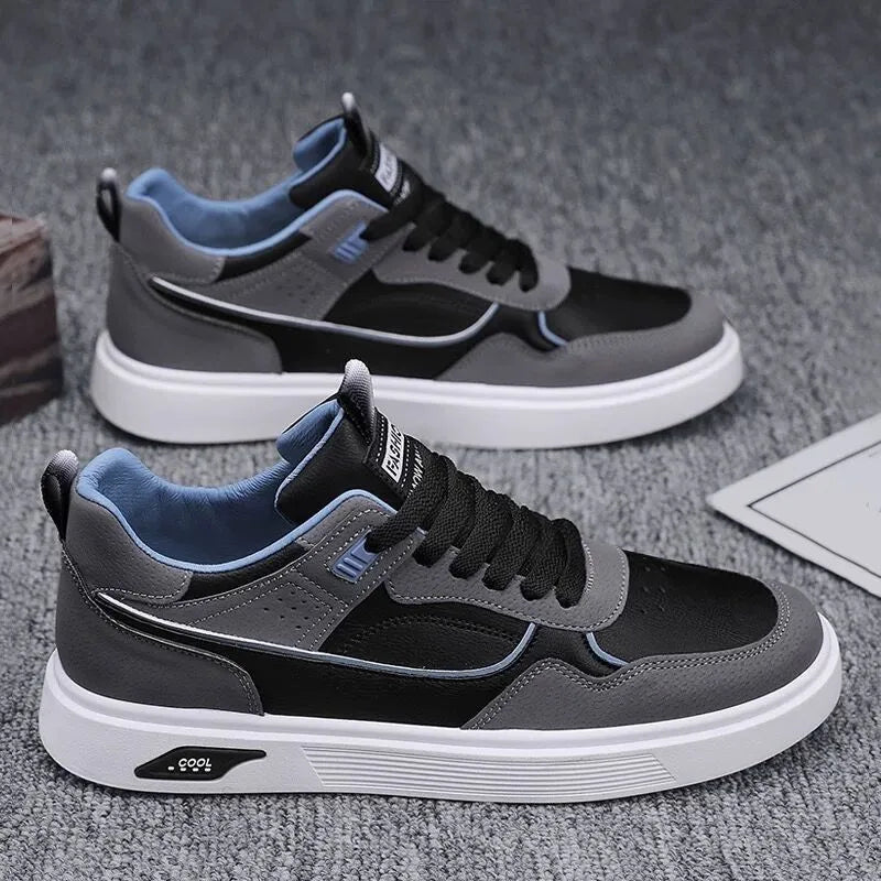 Men's low-top beige canvas board shoes with leather stitching details on a white background.