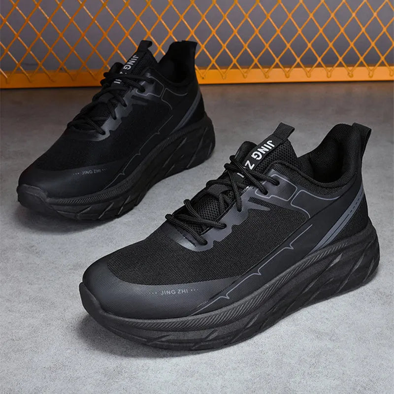 Men's black thick-soled anti-skid lace-up running sneakers with round toe and rubber sole on grey background