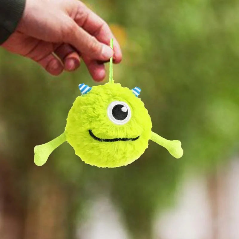 Green interactive dog toy ball with sound activation for teething and chewing