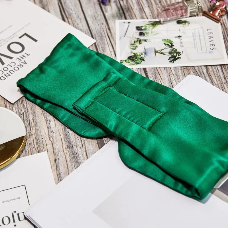 Mulberry silk sleep eye mask shown in one of seven colours: black, gold, blue, gray, white, pink, or green.