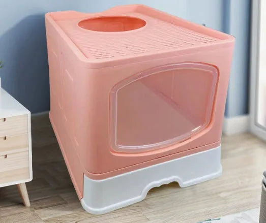 Folding enclosed cat litter box in ABS and PP, 51 x 41 x 44 cm, available in blue, pink, or grey.