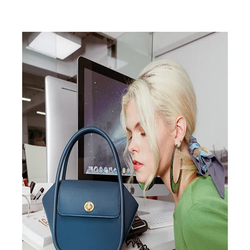 Women's cow leather wing handbag with cross-body strap and hand handles in black colour option