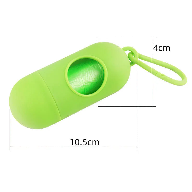 Black plastic dog poop bag dispenser with Velcro strap and a side metal hook.