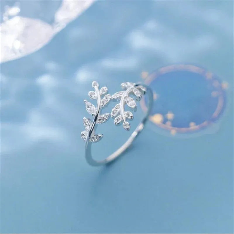 Women's leaf-shaped branch ring in electroplated copper, shown in silver and gold colour options.