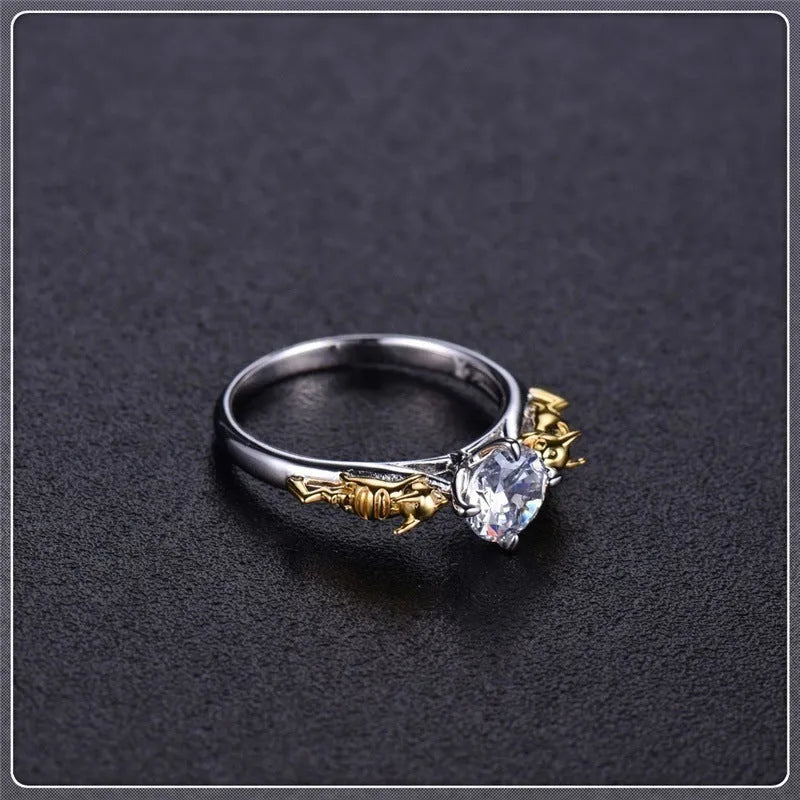 Close-up of a black gold finished copper ring with a detailed 1.5cm tall crown model on a person's finger.