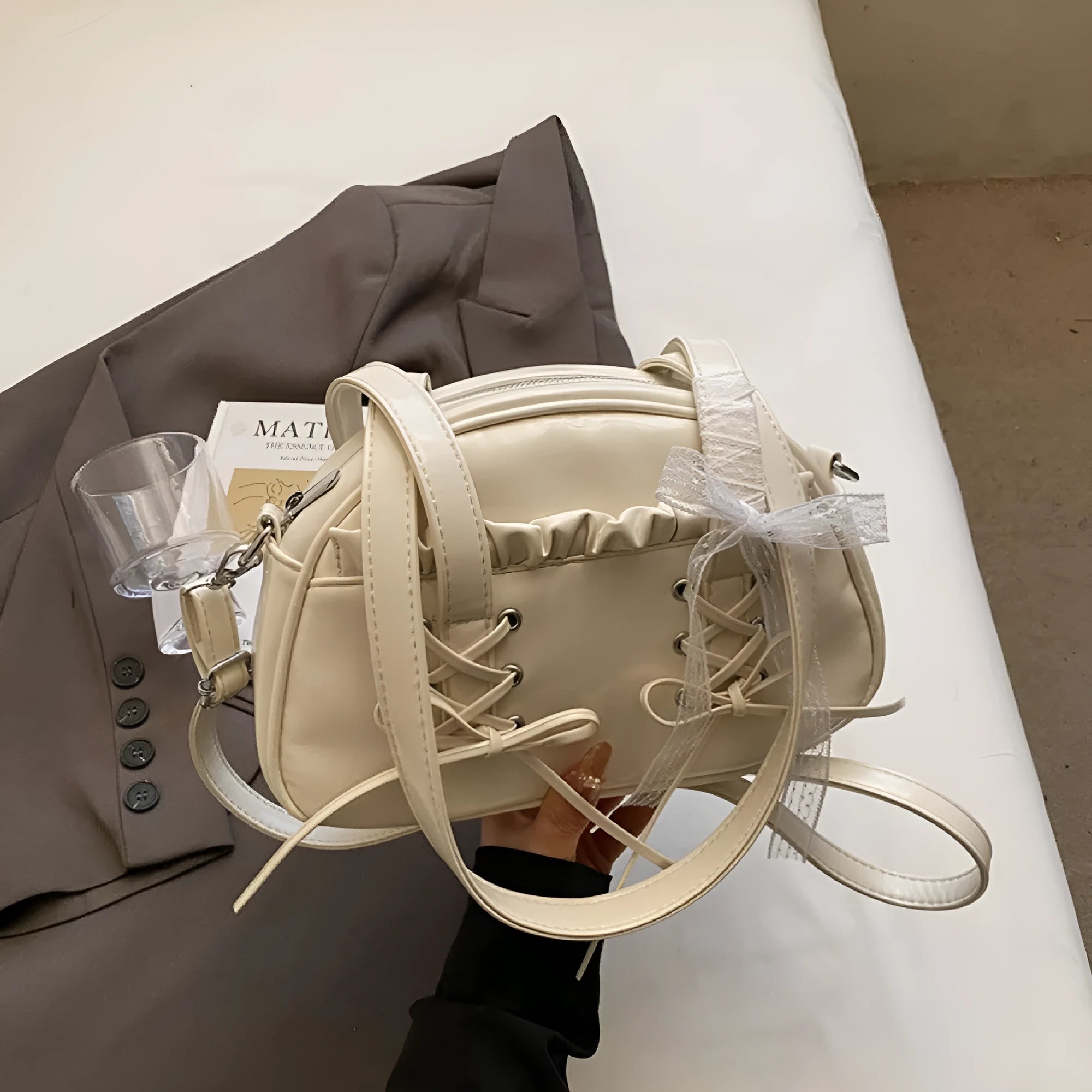 Women's fashion handbag with bow and bandage styling in PU leather, casual shoulder bag design