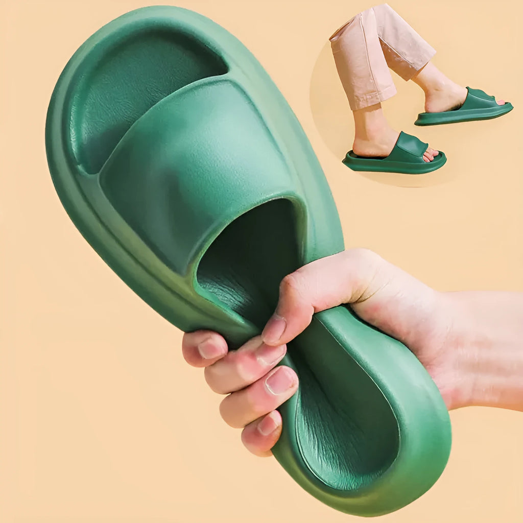 A pair of thick-soled EVA flip-flop slippers on a bathroom floor, showcasing non-slip tread and available colour options.