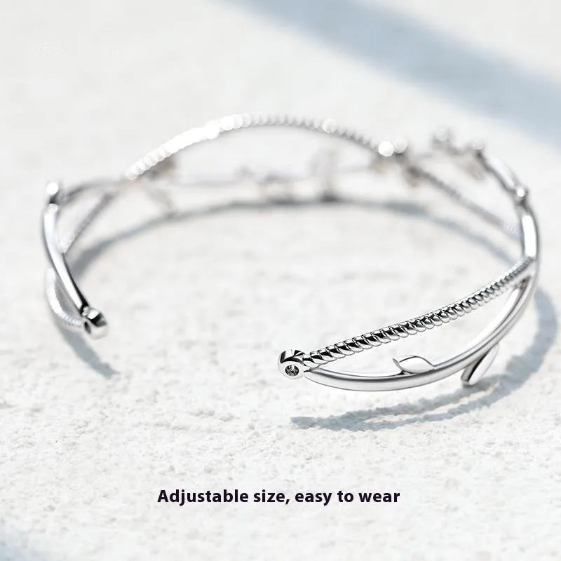 Copper tree branch sprout bracelet with cross twisted design in white gold electroplated finish
