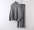 Women's milky white acrylic two-piece set with long sleeve top and wide-leg trousers on a hanger.