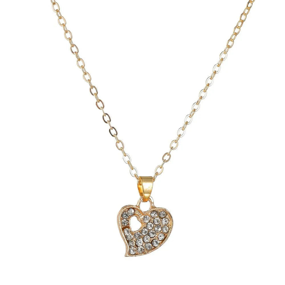 Women's gold electroplated jewellery set with earrings, pendant, and hand decoration featuring love, water drop, and bell patterns