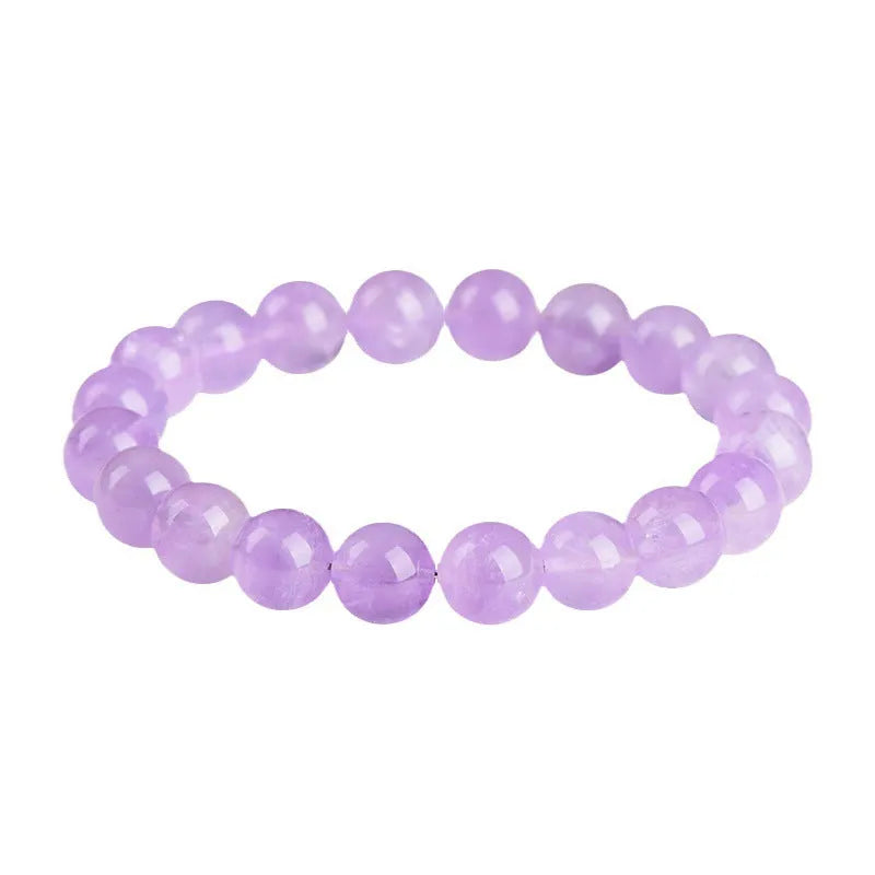 Lavender coloured amethyst crystal bead bracelet with round geometry shape and water ripple design.