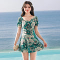 Women's solid-colour one-piece polyester swimsuit in blue, green, or yellow