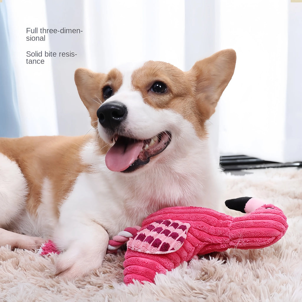 Pink corduroy animal-shaped plush dog toy with a squeaker inside on a neutral background.