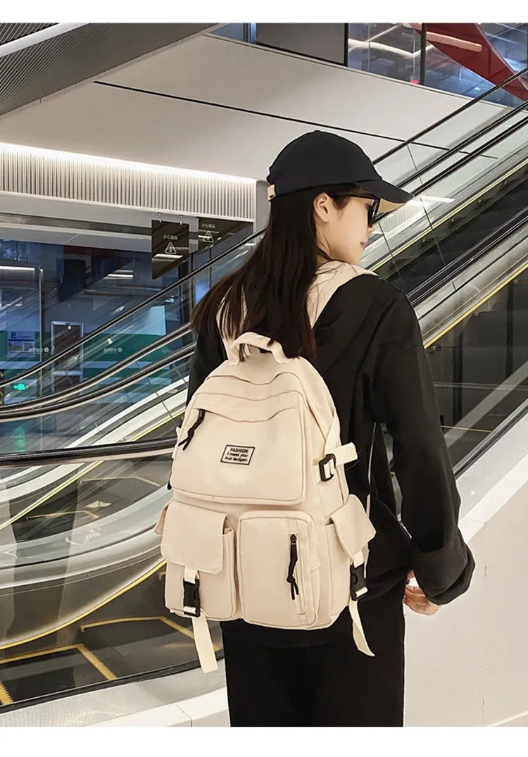 Soft nylon student backpack in black with three-dimensional pockets and laptop compartment