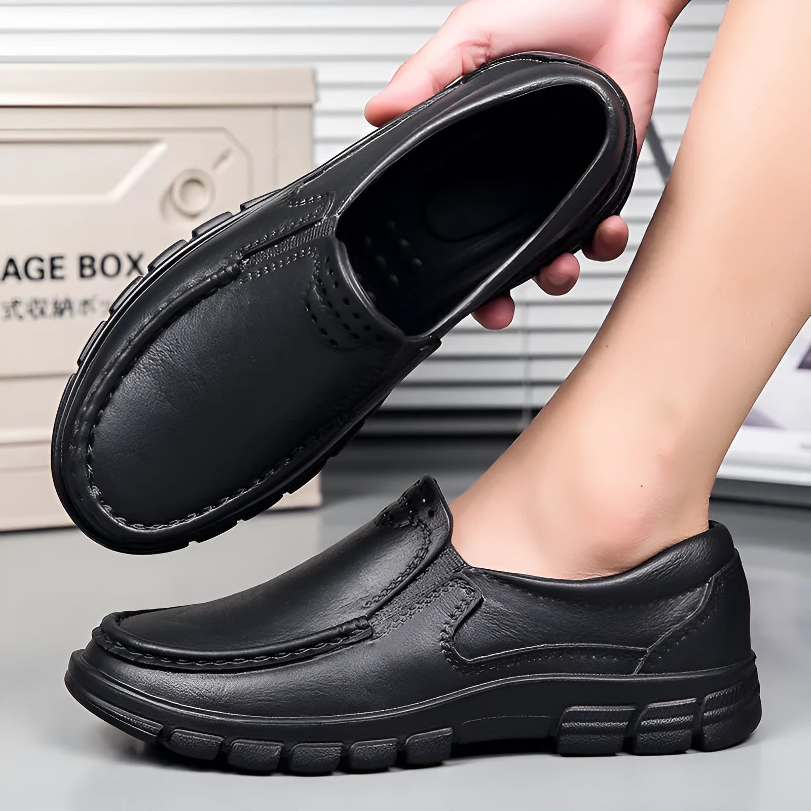 Men's black and brown slip-on work shoes with a waterproof platform and mid-top design.