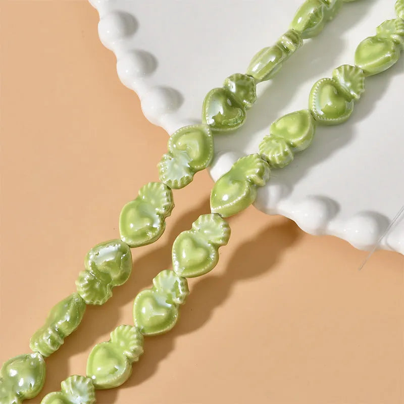 Love heart torch-shaped ceramic beads, about 10 x 15mm with 1.7mm straight hole, in cream white and other colours.