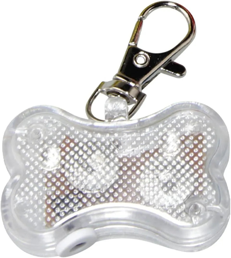 Blue LED luminous bone-shaped pendant for pet collars showing scale next to LR44 batteries.