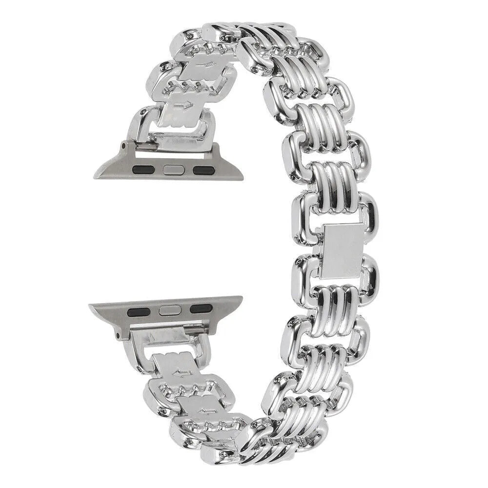 Silver alloy metal replacement bracelet strap for Apple Watch on a table.