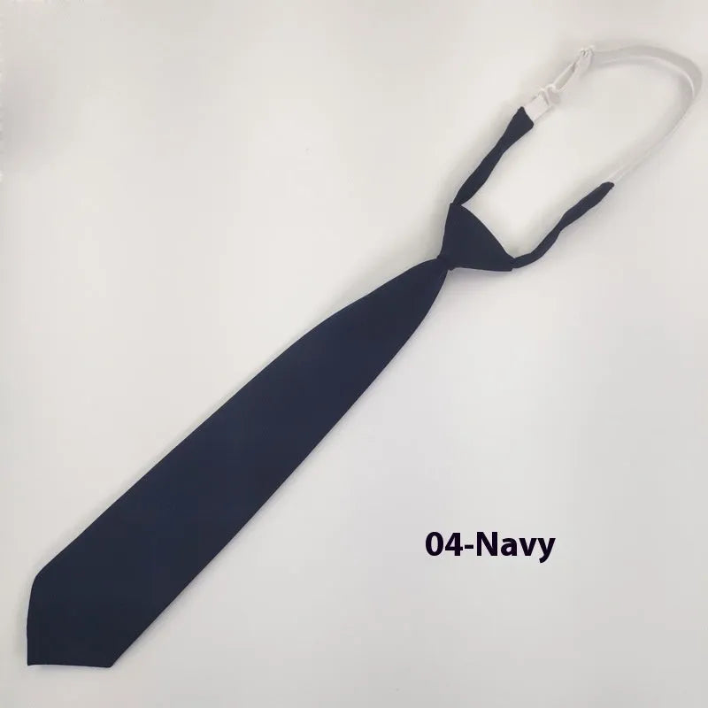 A navy blue cotton men's bow tie with an arrow style design on a white background.