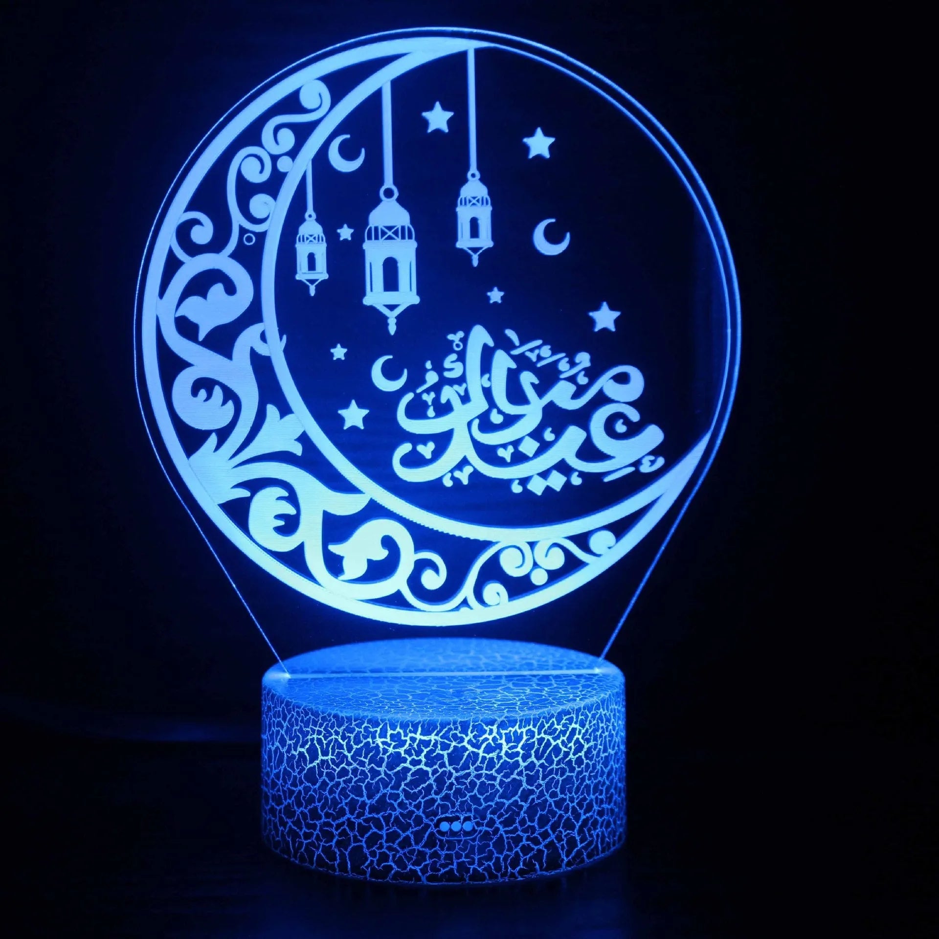 3D cartoon-style LED night lamp with black base and colourful lighting on bedside table