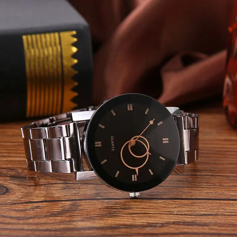 Black steel strap quartz analogue watch with metal case and glass mirror for men and women