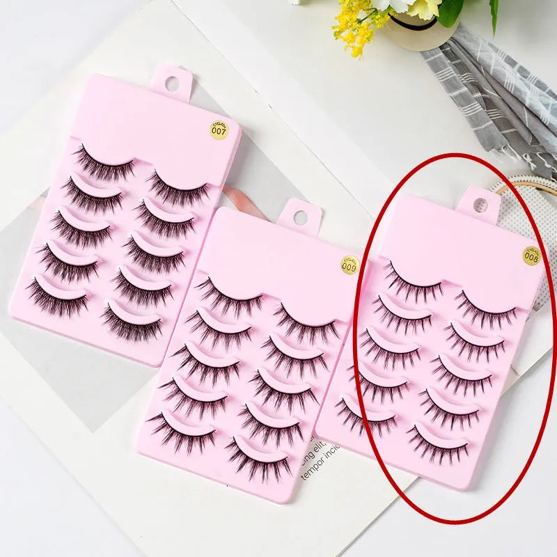 Set of manga style false eyelashes showing three wispy designs on a plastic black terrier base.