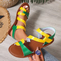 Women's flat sandals with Velcro strap, round toe, and rubber sole in black, brown, and colourful options.