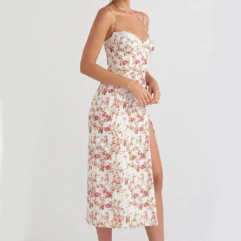 Blue women's long dress with white lace flower print, side slit, and thin suspender straps.
