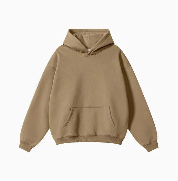 A loose-fitting men's cotton hooded sweater in a pullover style on a hanger.