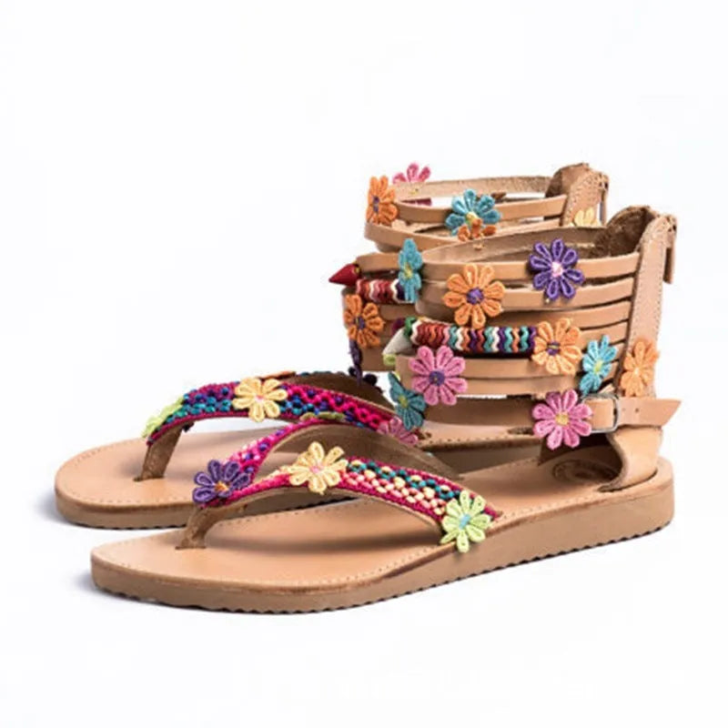 Ethnic beaded petal sandals with floral decoration and round toe.