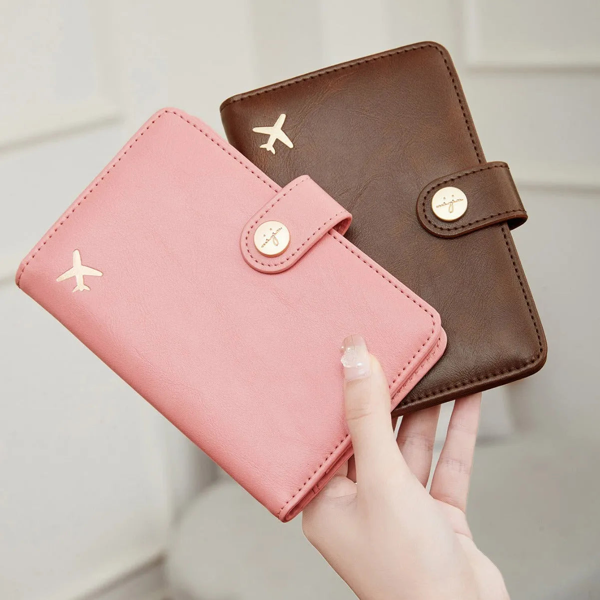 PU passport holder wallet in multiple colours with zip closure and visible sewing detail.
