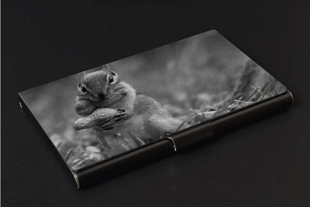 Metal titanium business card holder in black finish holding business cards