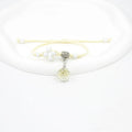 Hand-woven glass bracelet with large beads containing real dried flowers, shown in multiple colour options.