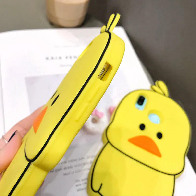 Green and yellow silicone iPhone cases with animal cartoon designs on a white background.