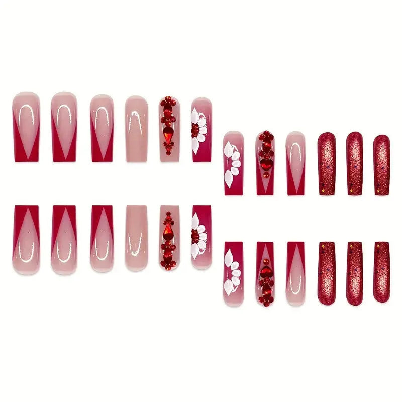 Long European square fake nails with sweet floral pattern and prismatic red diamond crystal accents.