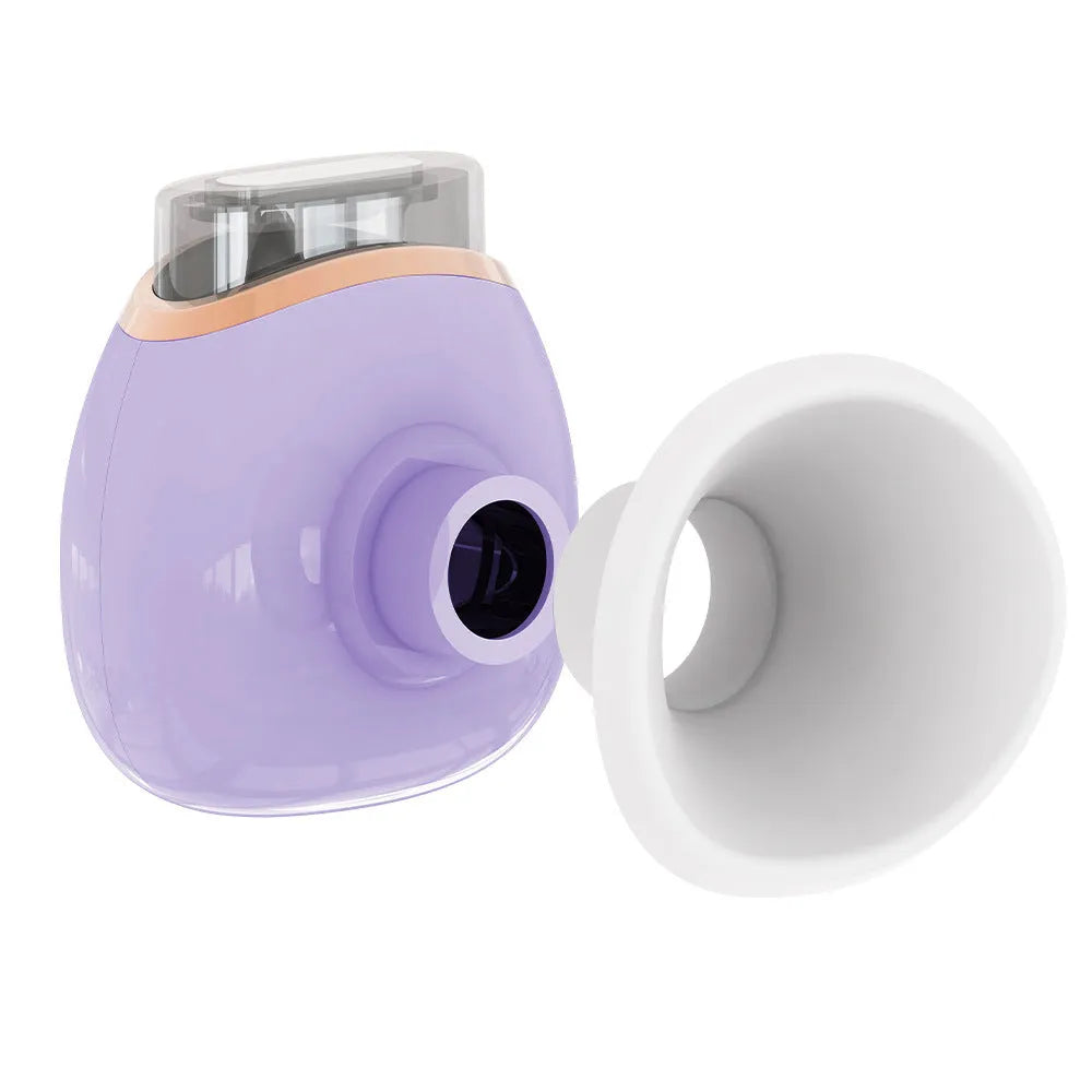 White and purple household eye humidifier with charging cable on wooden table