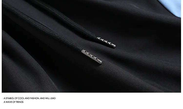 Quick-drying black and grey sports shorts with elastic waist and loose fit design